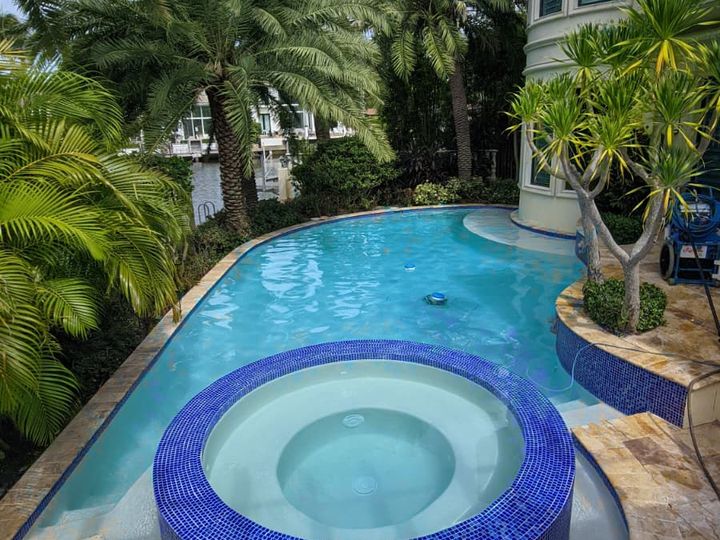 Resurfaced pool and spa with blue tile